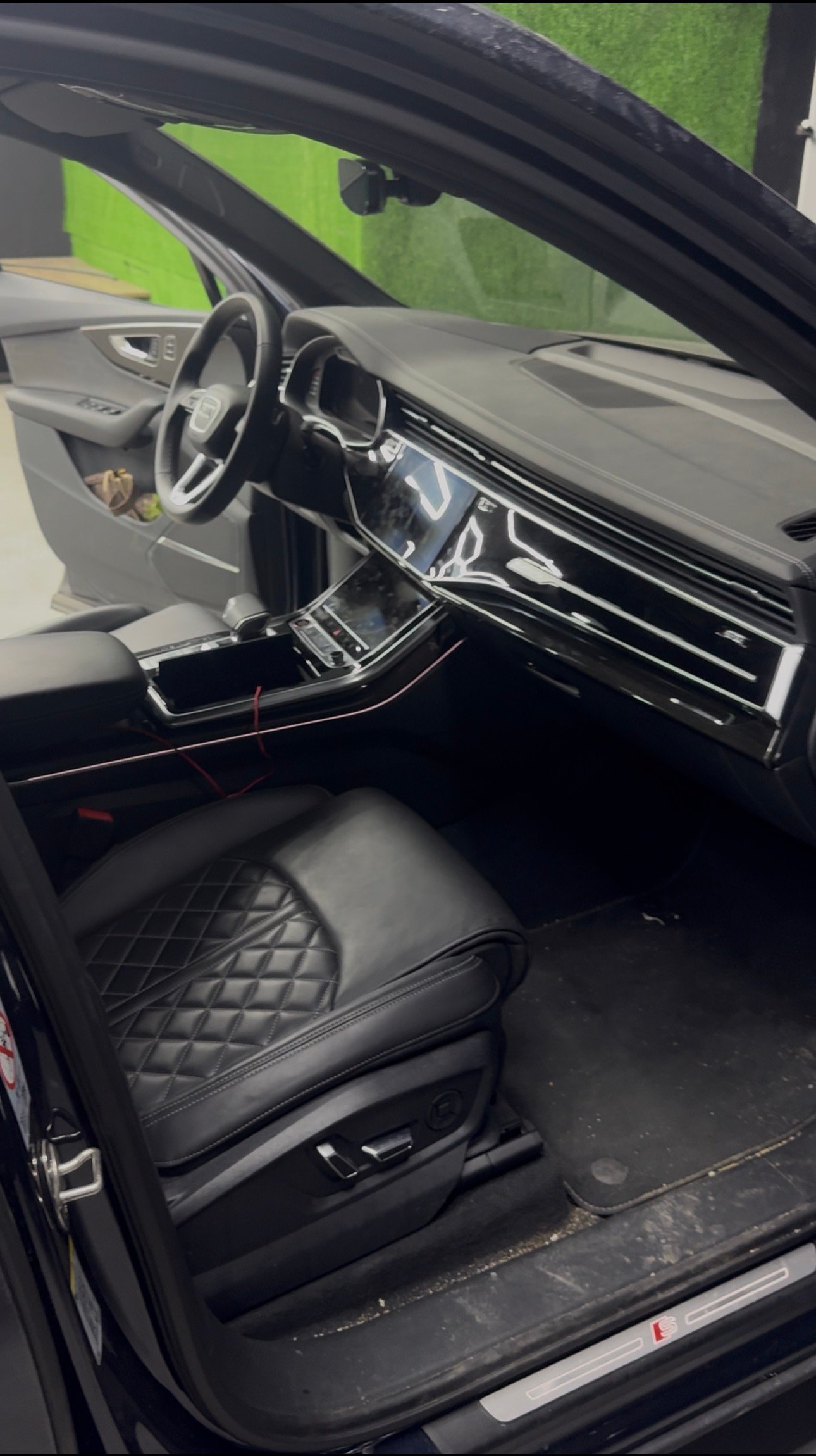 Audi SQ7 interior before — dust and grime in the footwells