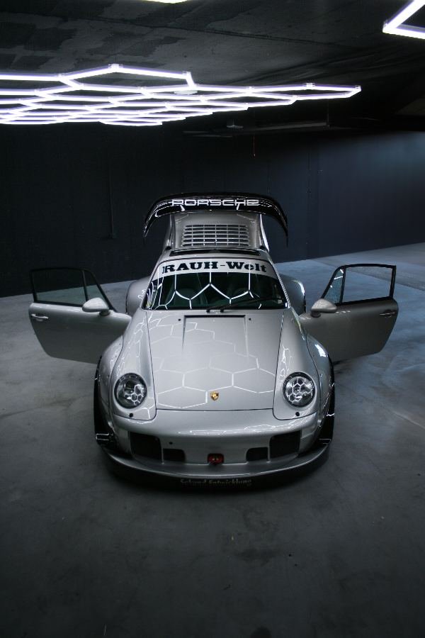 RWB Porsche 993 front with both doors open under hexagon lights