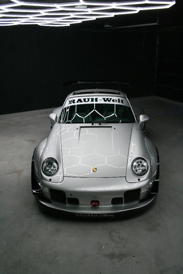 RWB Porsche 993 from above with hexagon lights reflected in the paint